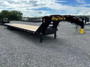 A large, black Big Tex 8.5x40 gooseneck deckover equipment trailer. The trailer features a flat, wide deck over the wheels, a gooseneck hitch, and heavy-duty mega ramps at the rear for loading equipment.