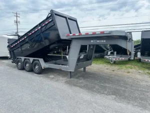 A black BWise 7x16 gooseneck dump trailer featuring its powerful tri-axle configuration, heavy-duty frame, and hydraulic dump bed, ready for maximum payload jobs.